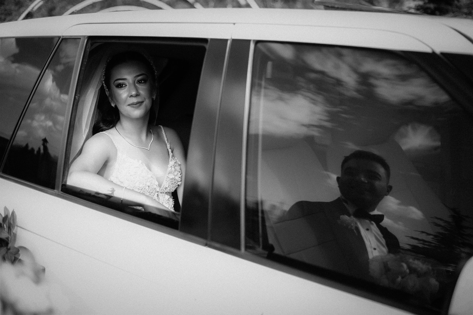 Bridge Sitting in a Limousine and a Reflection of the Bridegroom - denver car service