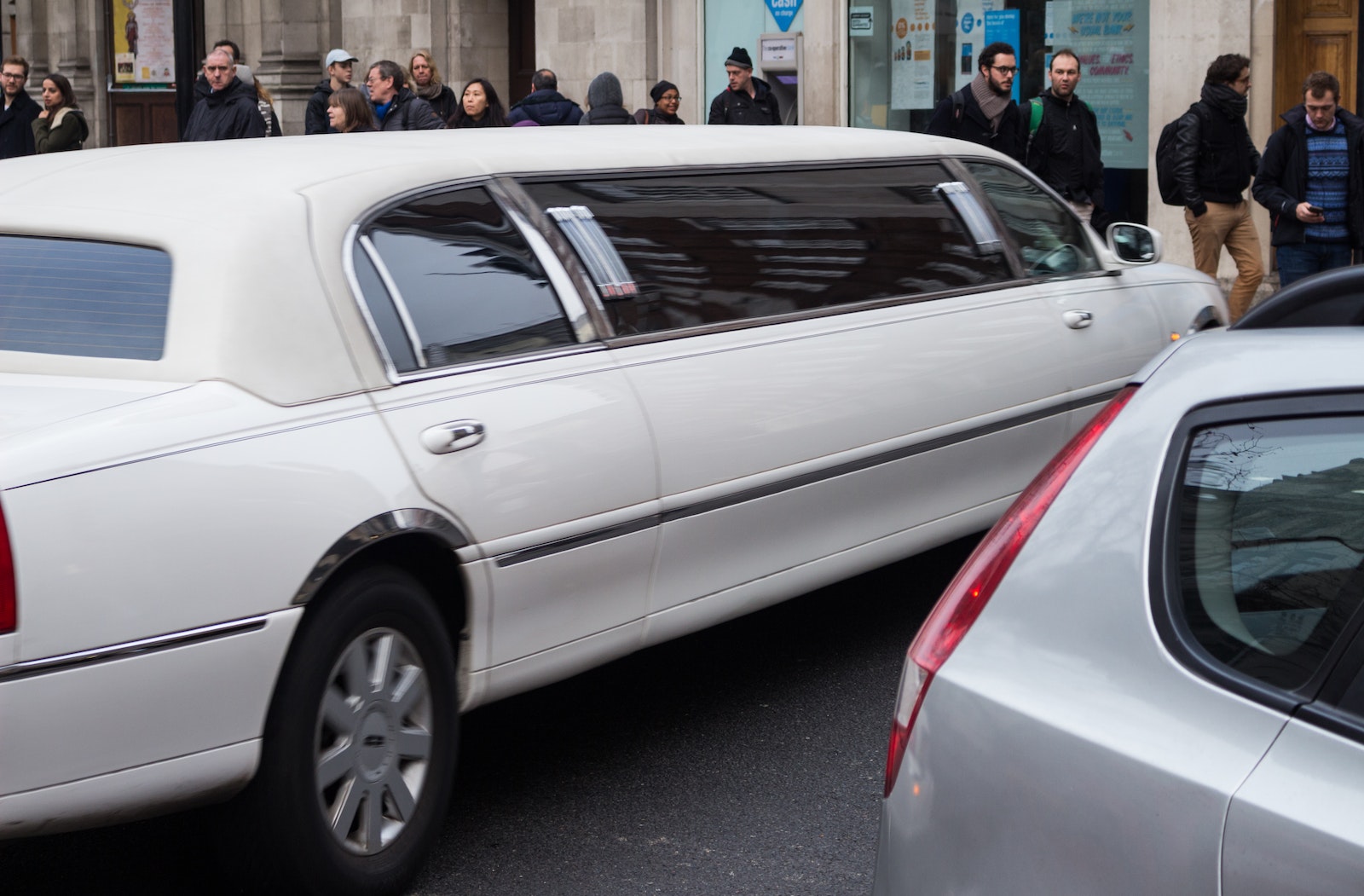limo service White Limousin Car Parked on Building , denver limousine service