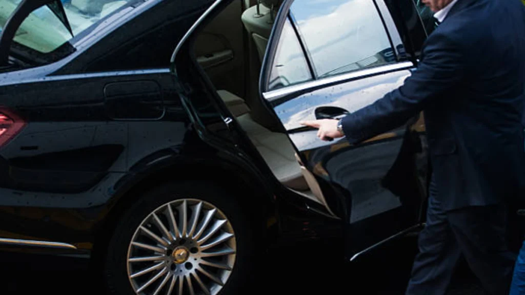 Luxury car transport service in Denver with black SUVs and Sprinter Vans