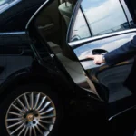 Luxury car transport service in Denver with black SUVs and Sprinter Vans