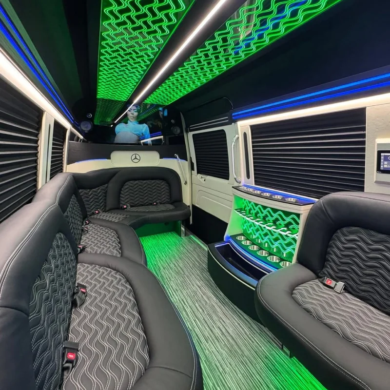 VIP Sprinter limo Denver interior with ambient lighting and bar setup